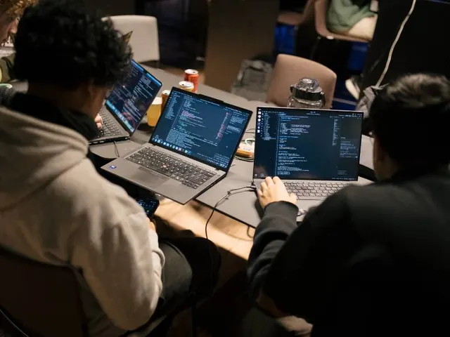 A team of builders working across three laptops late into the event